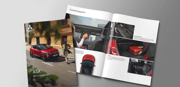 Die aufgebl&auml;tterte Brosch&uuml;re des ASX liegt auf grauem Untergrund.