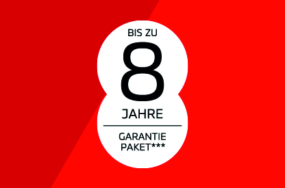 Wei&szlig;er, runder Hinweisbutton auf rotem Hintergrund mit der Aufschrift &bdquo;Bis zu 8 Jahre Garantiepaket***"