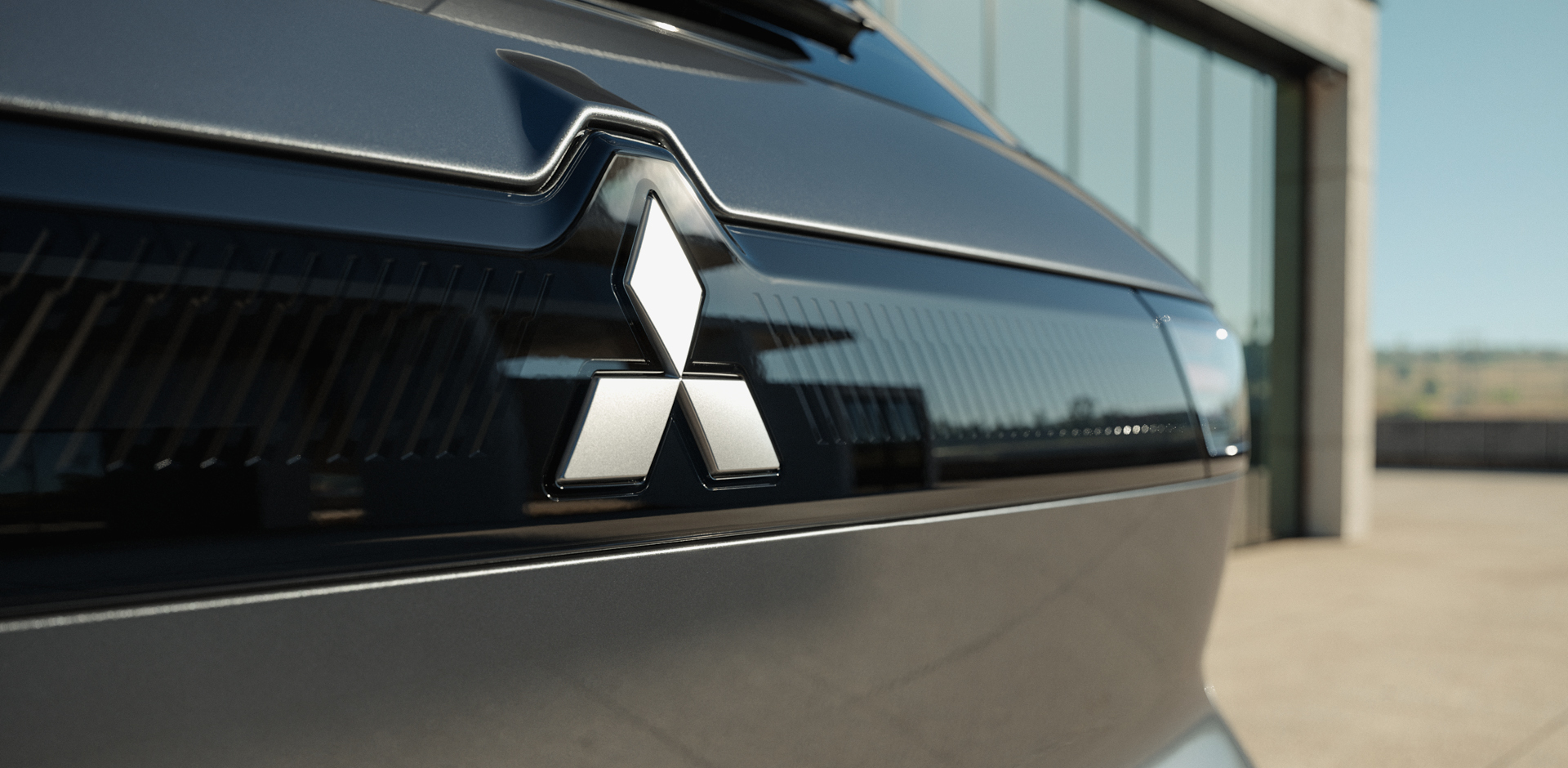 MITSUBISHI MOTORS. Unsere Marke Ausschnitt eines Mitsubishi Heck